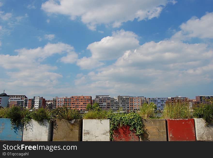 Some very modern Canal Houses in Amsterdam wth colorfull stuff on the front and a blue cloudy sky. Some very modern Canal Houses in Amsterdam wth colorfull stuff on the front and a blue cloudy sky