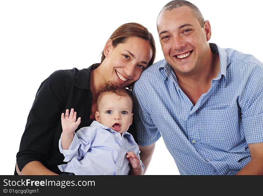 A lovely young family having fun in the studio, isolated on white. A lovely young family having fun in the studio, isolated on white.