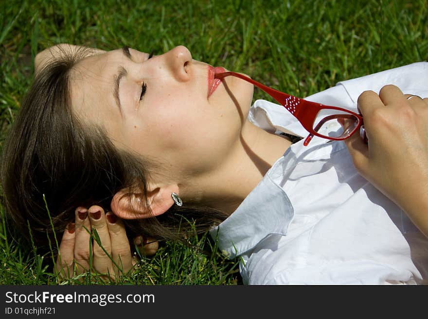 The woman with points has a rest on a grass