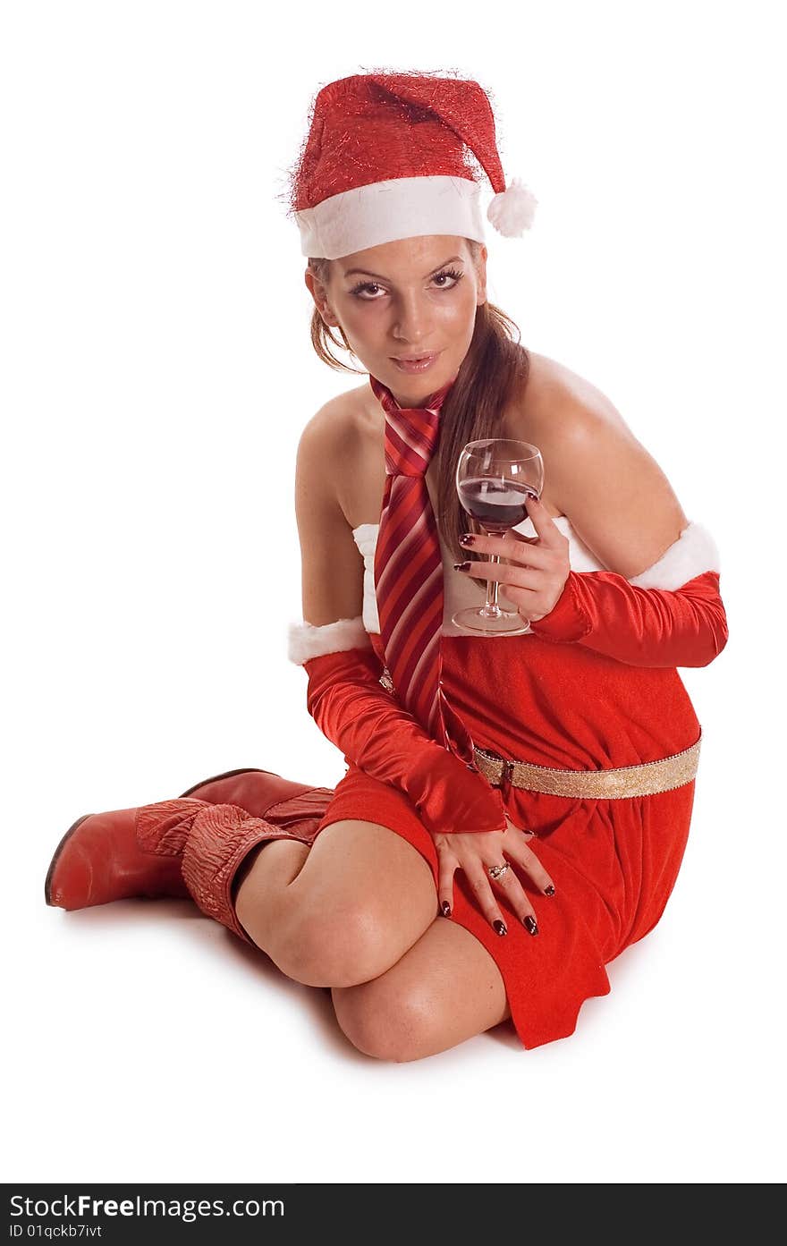 Pretty santa girl drinking a red wine