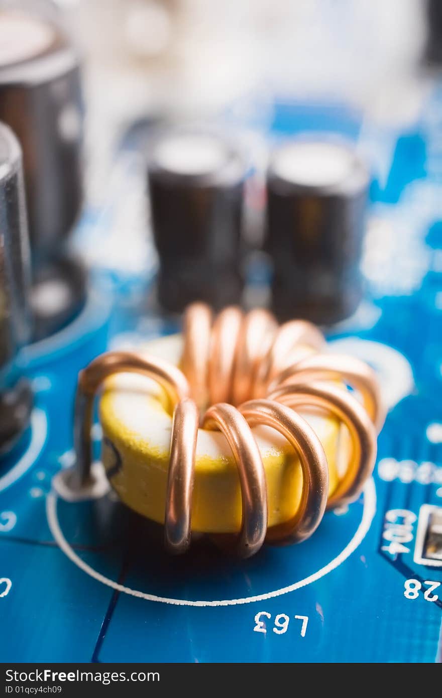 Coil on a motherboard, hardware macro shot