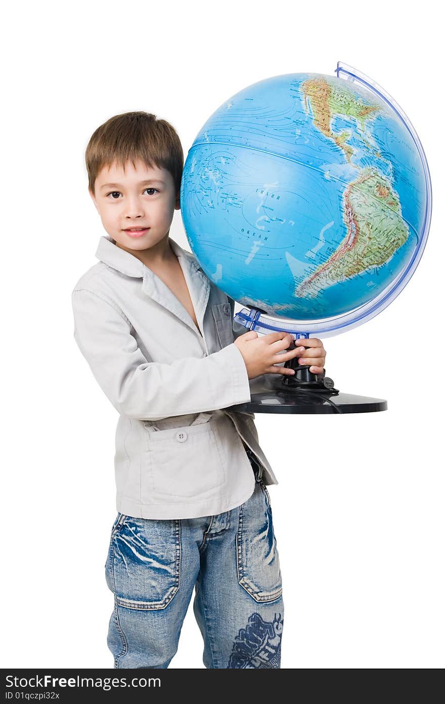 A 6 y.o. boy with a globe isolated on white