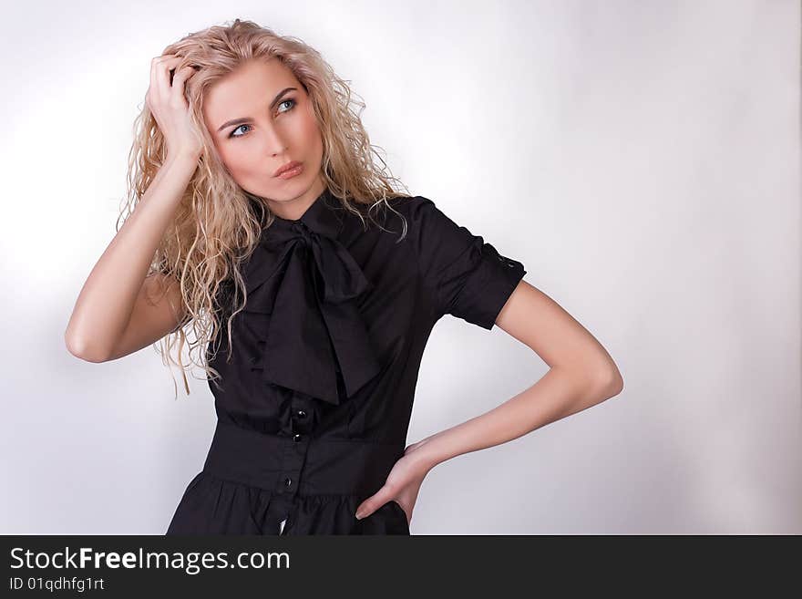 Thinking nice young girl, studio shot