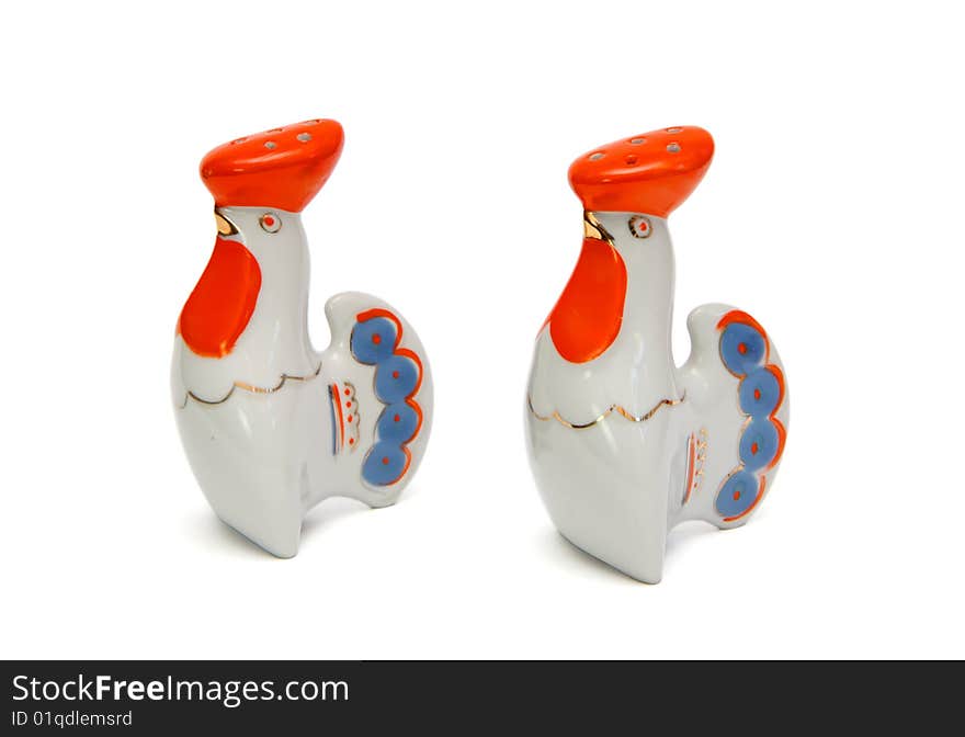 Porcelain rooster saltsellars isolated