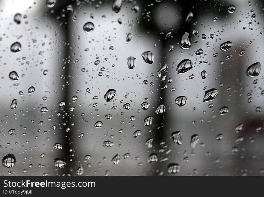 Shiny drops on a Window creating fascinating optical effects. Shiny drops on a Window creating fascinating optical effects.