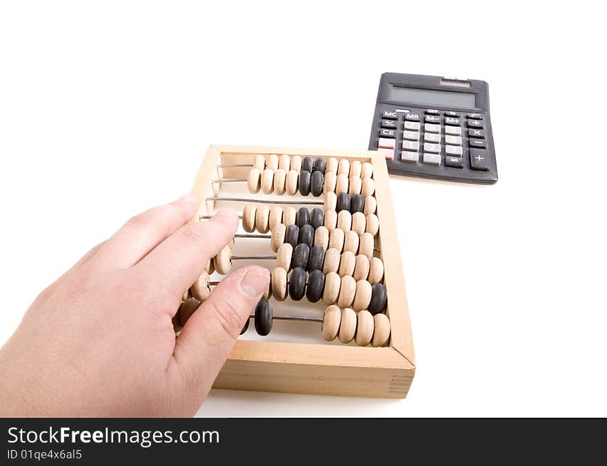 Abacus and calculator on white ground. Abacus and calculator on white ground