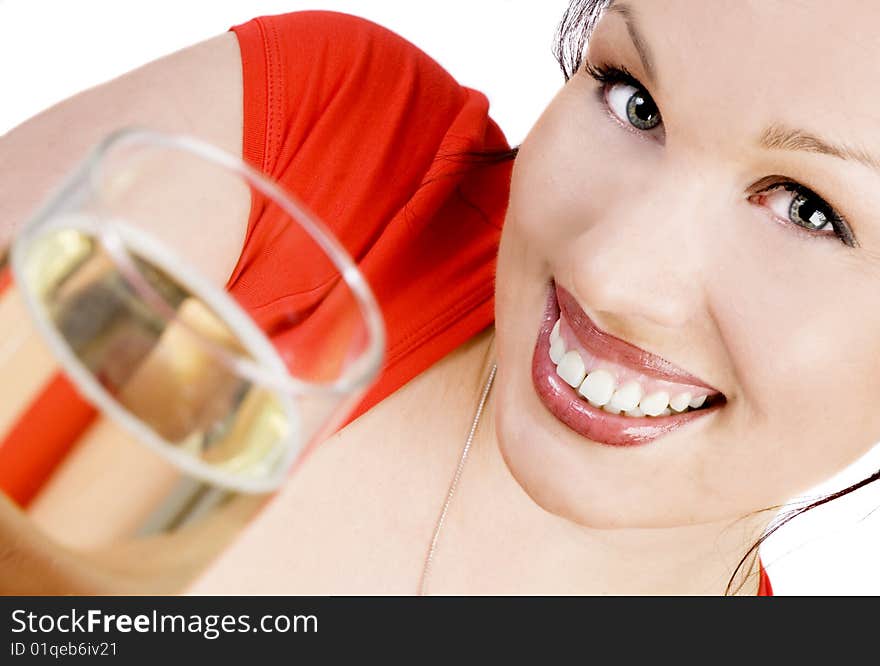 Happy brunette with a glass of champagne isolated on white