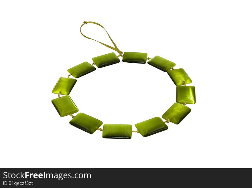 Beads, necklace from cat's eye green on a white background