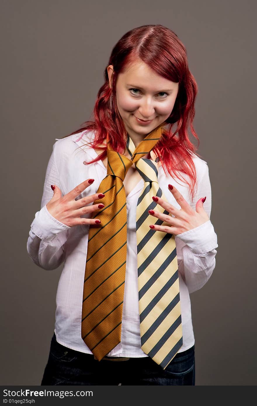 Smiling red haired woman with tie separated