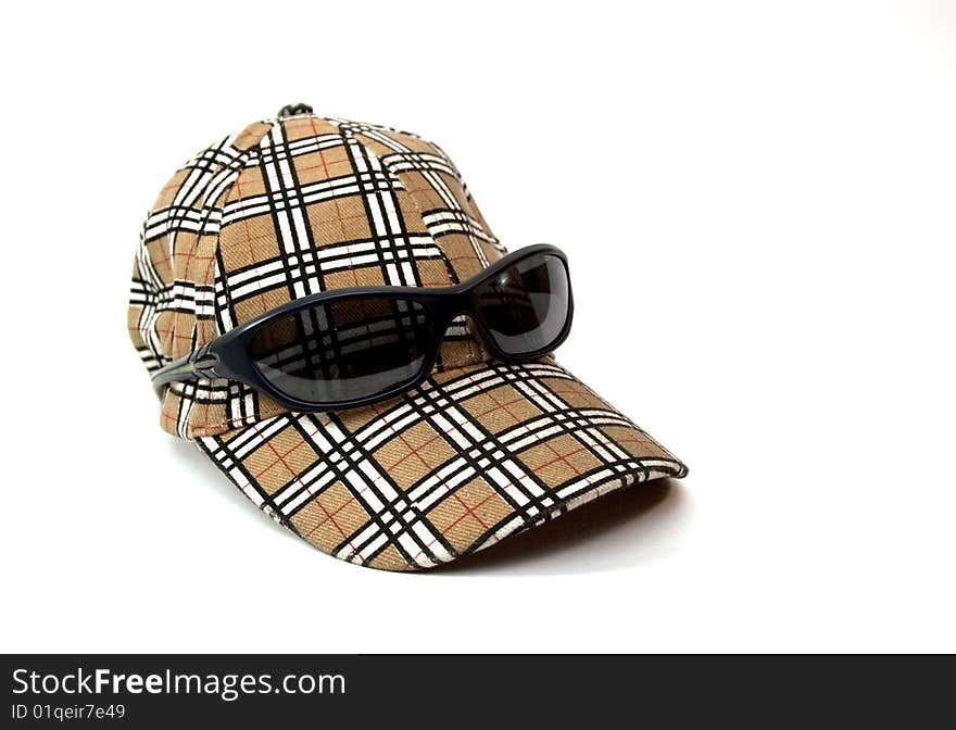 Sport cap isolated with sunglasses. Sport cap isolated with sunglasses