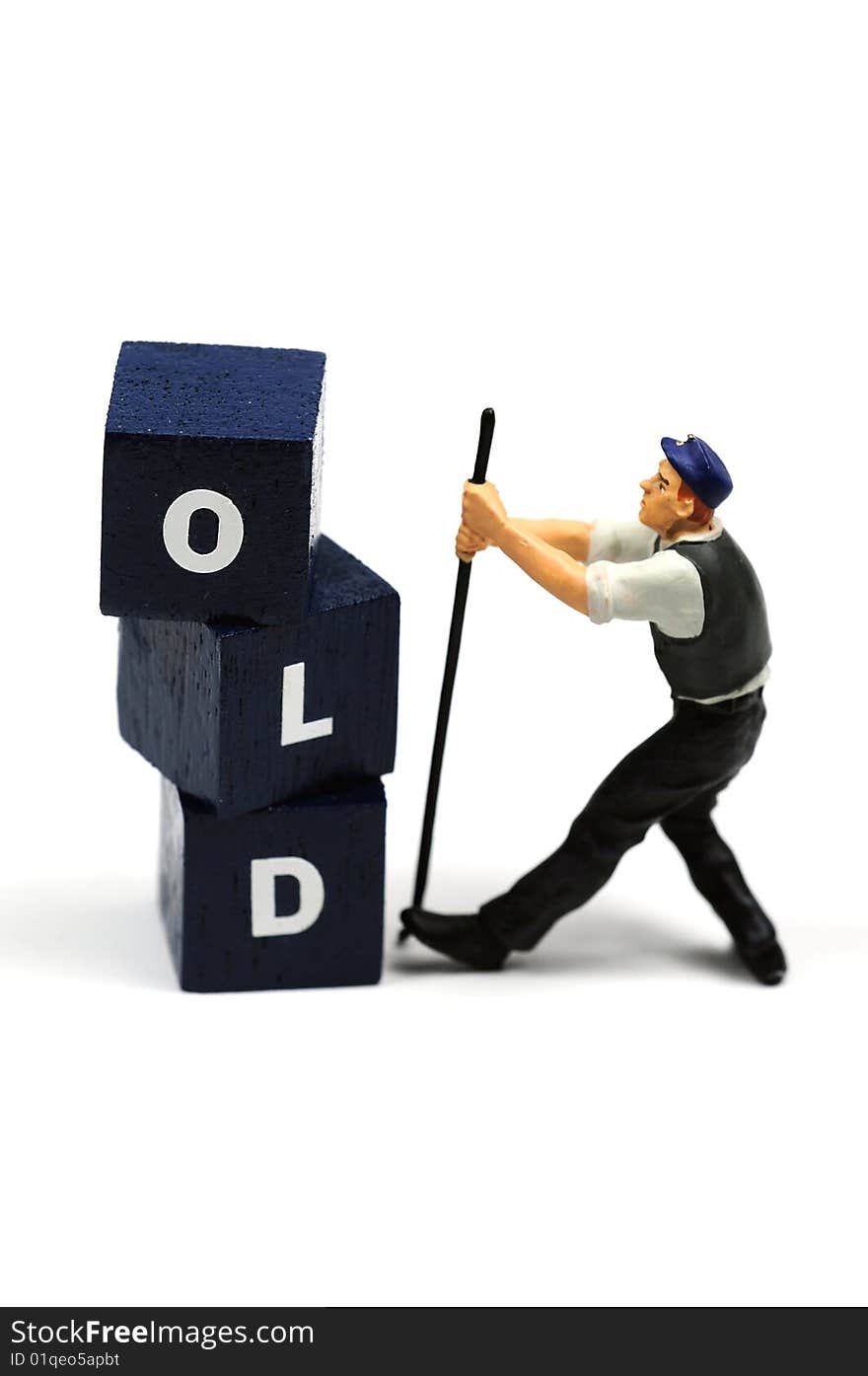 A workman tearing down the word old. A workman tearing down the word old