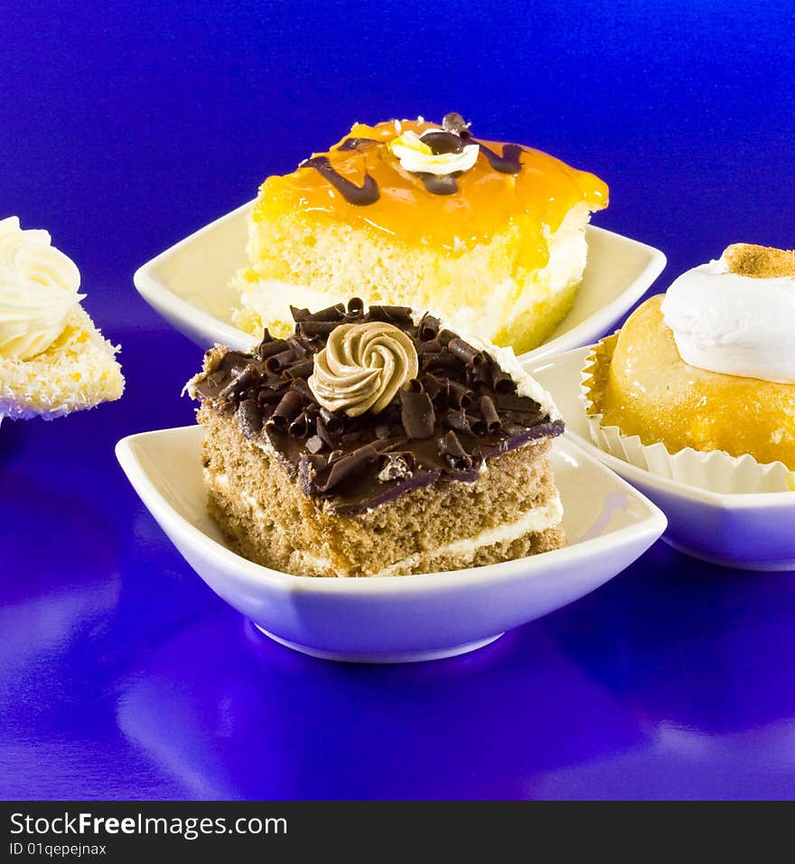 Pies with white spoons on blue background. Pies with white spoons on blue background