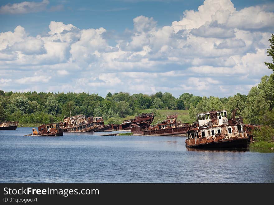 Old rusty ships in the river near of Chernobyl. Old rusty ships in the river near of Chernobyl