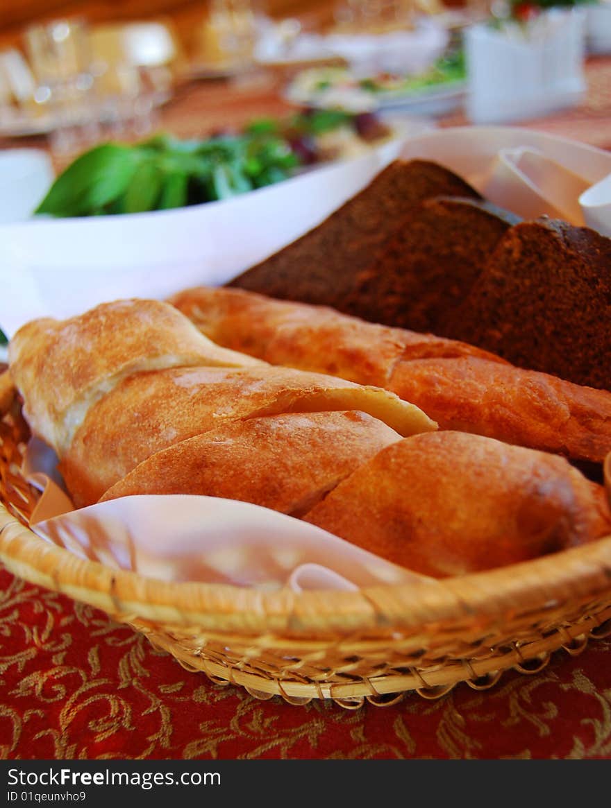 Loaves in a ped on a red table-cloth. Loaves in a ped on a red table-cloth