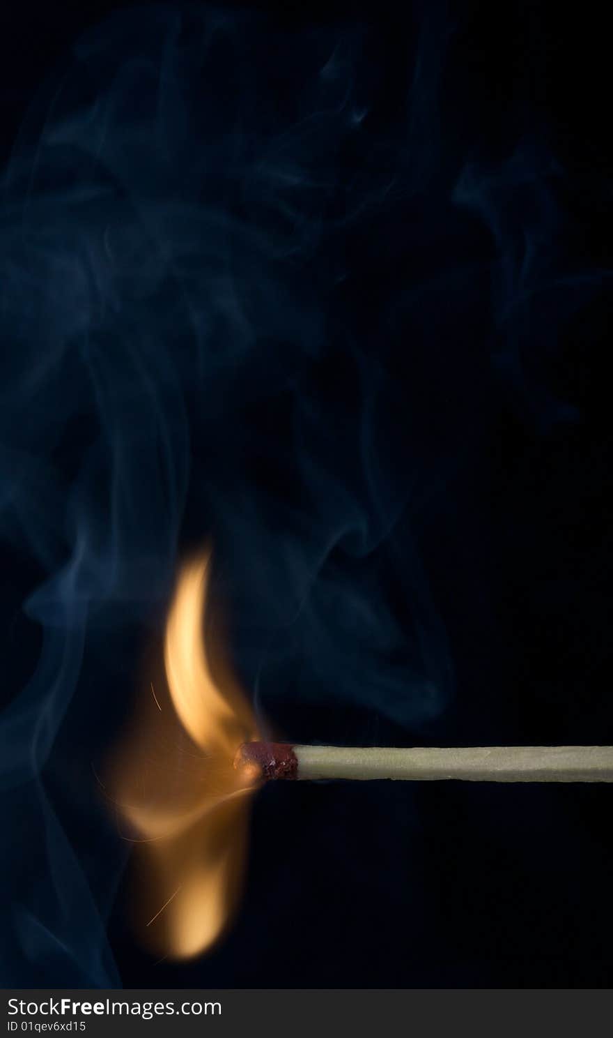 Burning Match on black background