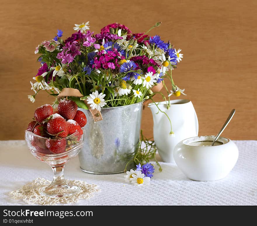 Still life with strawberries and wild flowers