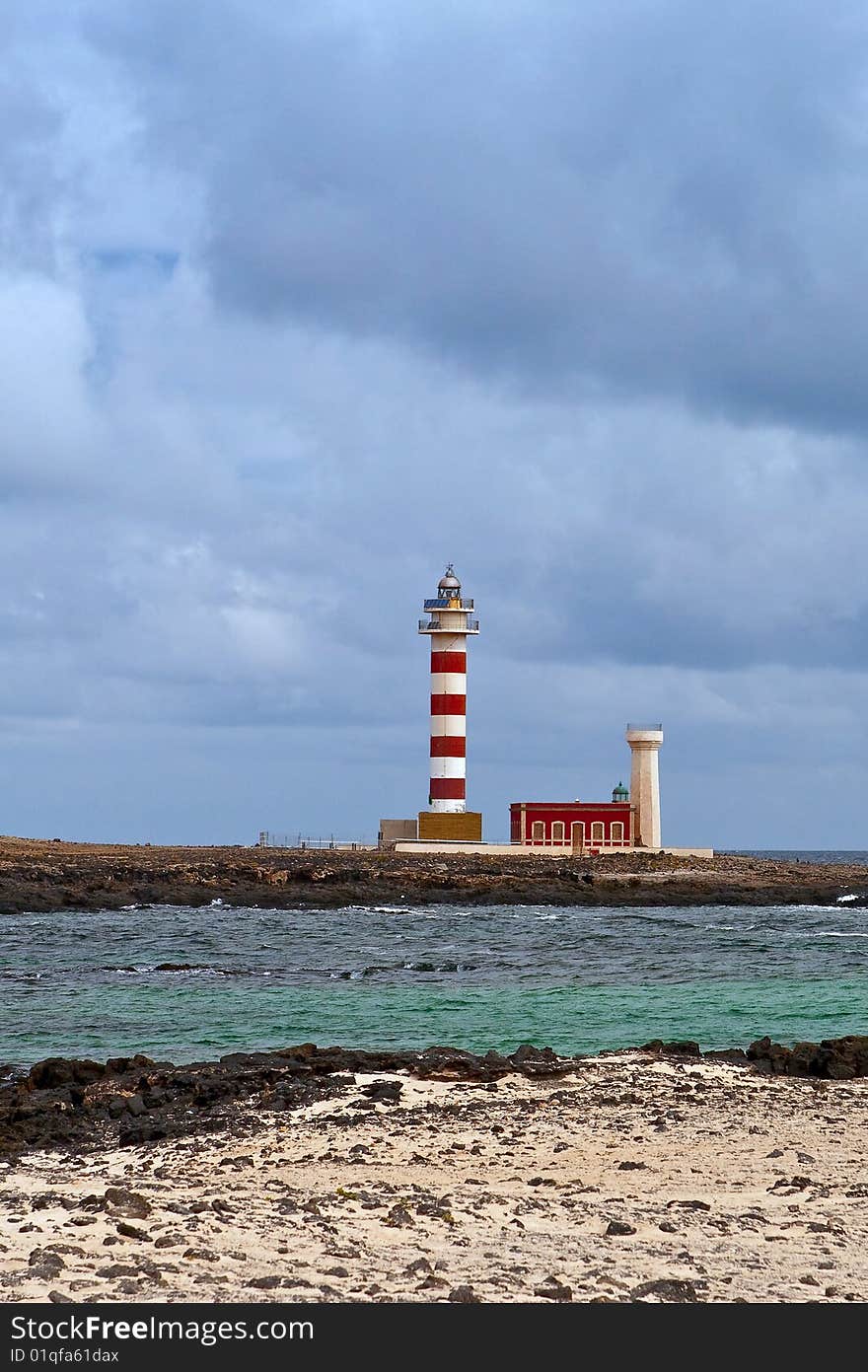 The lighthouse Faro de Toston, Fuerteventura. The lighthouse Faro de Toston, Fuerteventura.