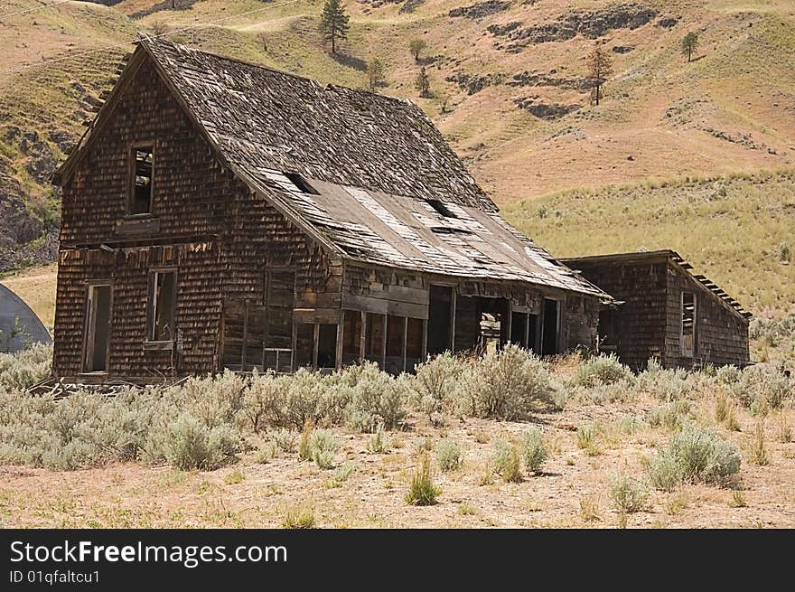 This is an old, ancient abandoned homestead building set in the arid mountains of Washington state. This is an old, ancient abandoned homestead building set in the arid mountains of Washington state.