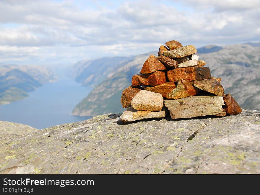 Small building made of stones - In background sea and clouds. Small building made of stones - In background sea and clouds