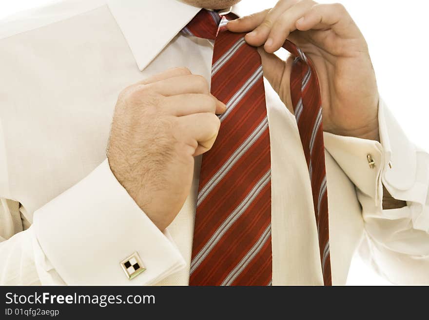 Businessman adjusting tie