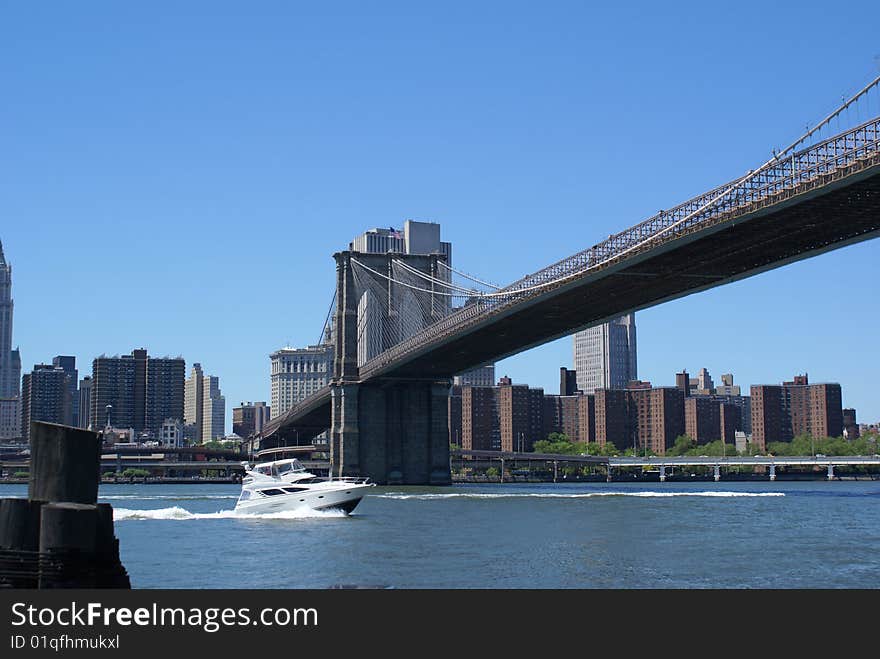 Boat Under Brooklyn Bridge