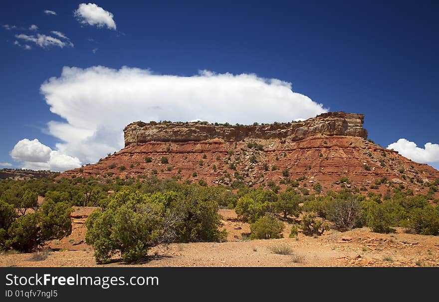 View of red rock formations in San Rafael Swell with blue sky�s the and clouds