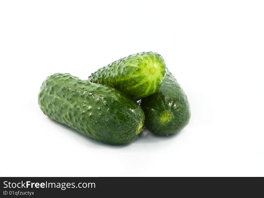 Fresh green cucumbers isolated on white background