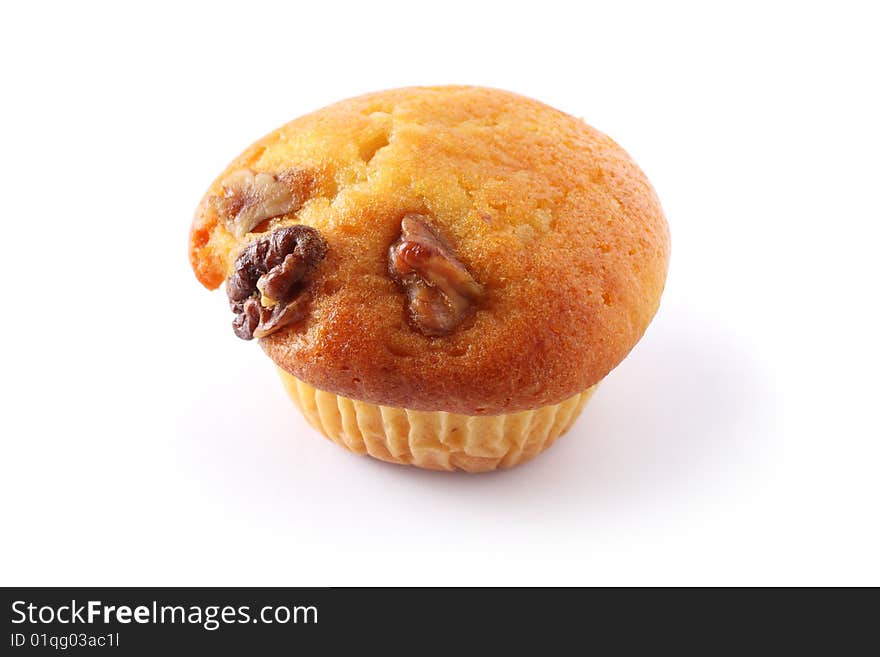 A vanilla muffin with almond nuts isolated on white background. A vanilla muffin with almond nuts isolated on white background.