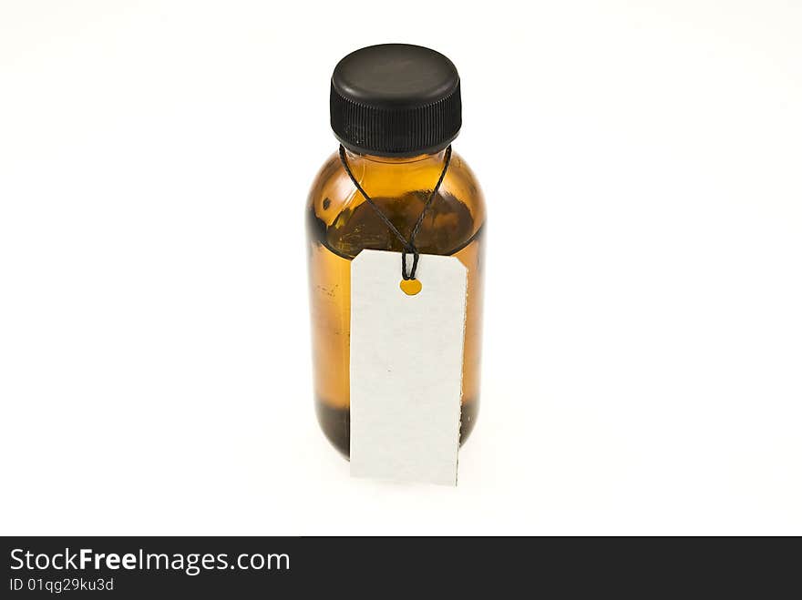 Brown glass bottle with tag

isolated on white