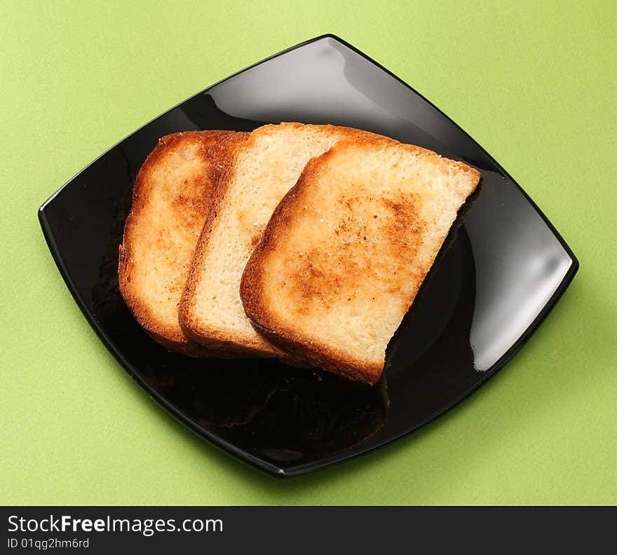 Toasts on black plate