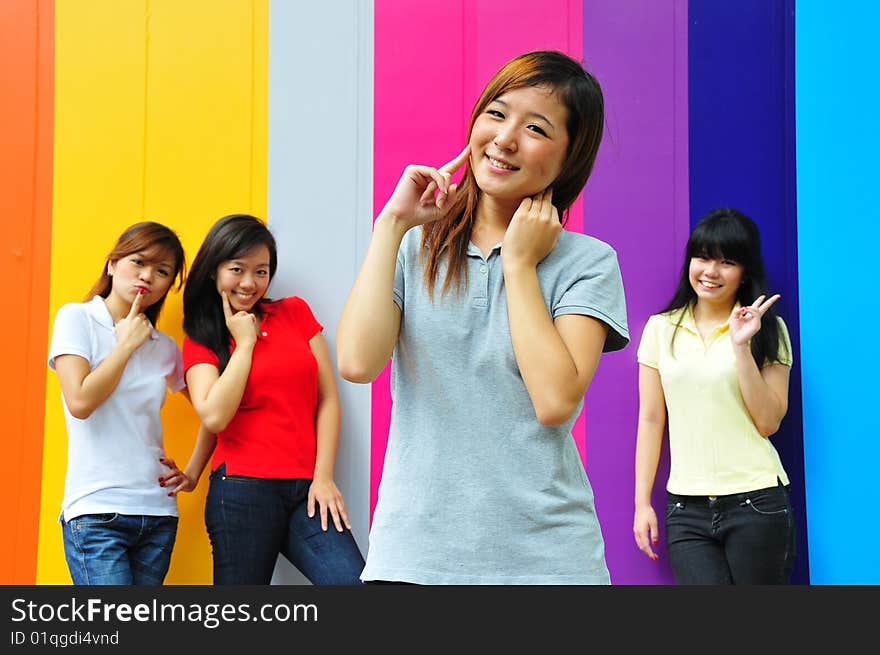 Beautiful Young Women Having Fun With Colourful Background. Beautiful Young Women Having Fun With Colourful Background.