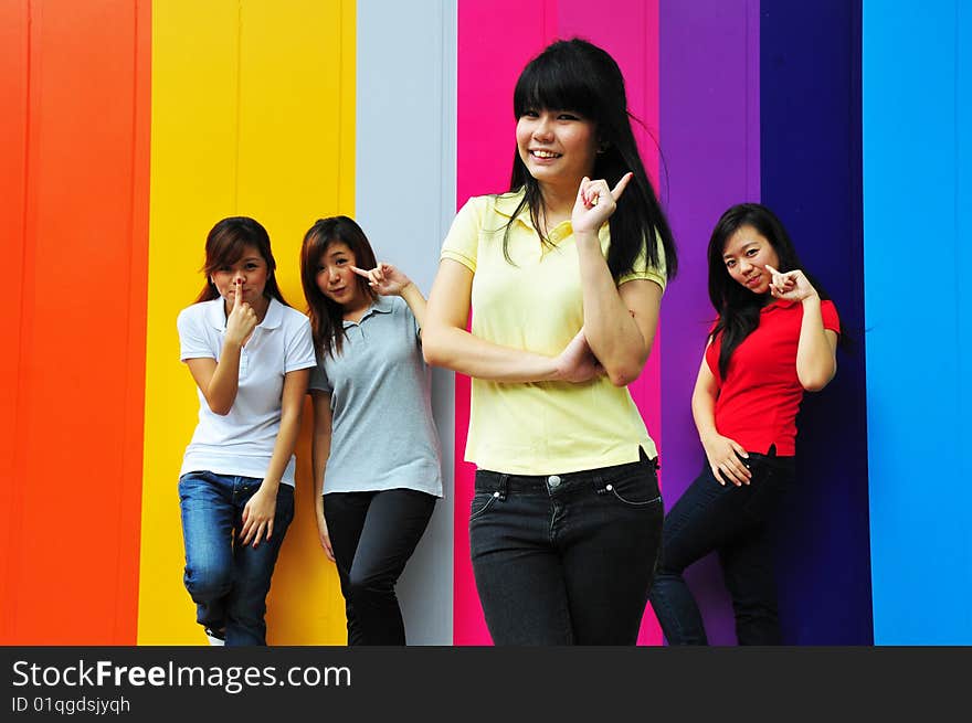 Beautiful Young Women Having Fun With Colourful Background. Beautiful Young Women Having Fun With Colourful Background.