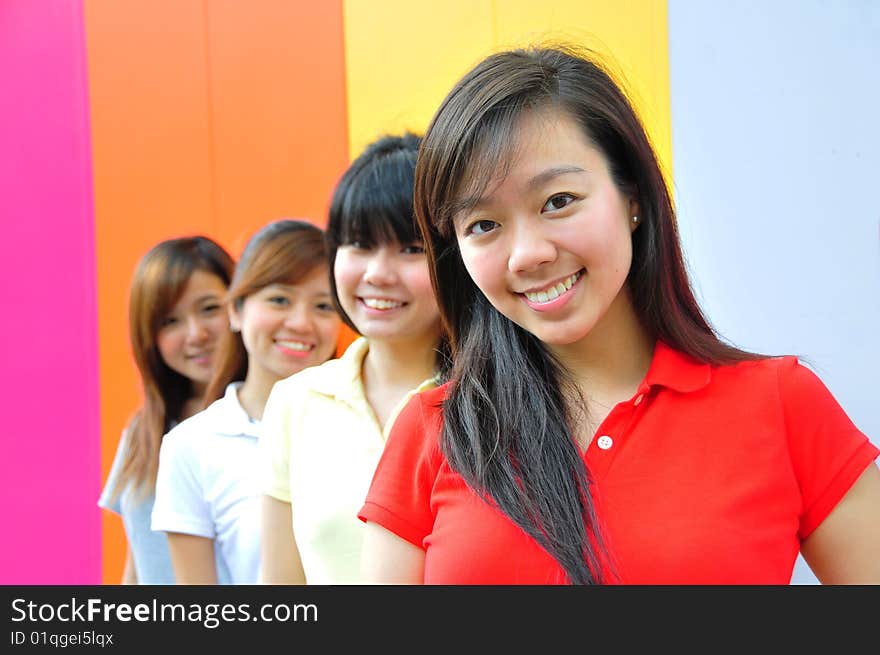 Beautiful Young Women Having Fun With Colourful Background. Beautiful Young Women Having Fun With Colourful Background.