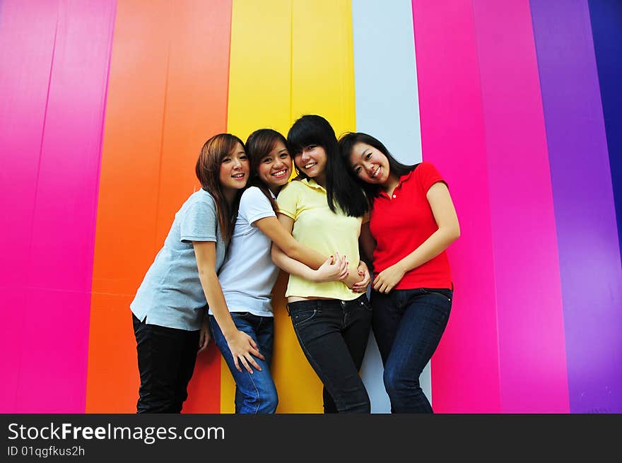 Beautiful Young Women Having Fun With Colourful Background. Beautiful Young Women Having Fun With Colourful Background.