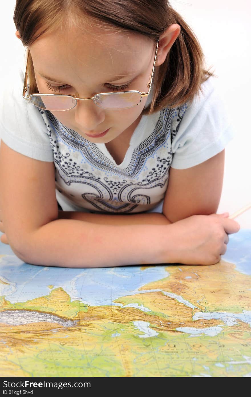 Girl exploring the map of Eurasia