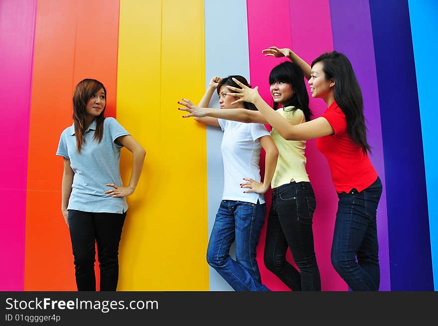 Beautiful Young Women Having Fun with Colouful Backgound.