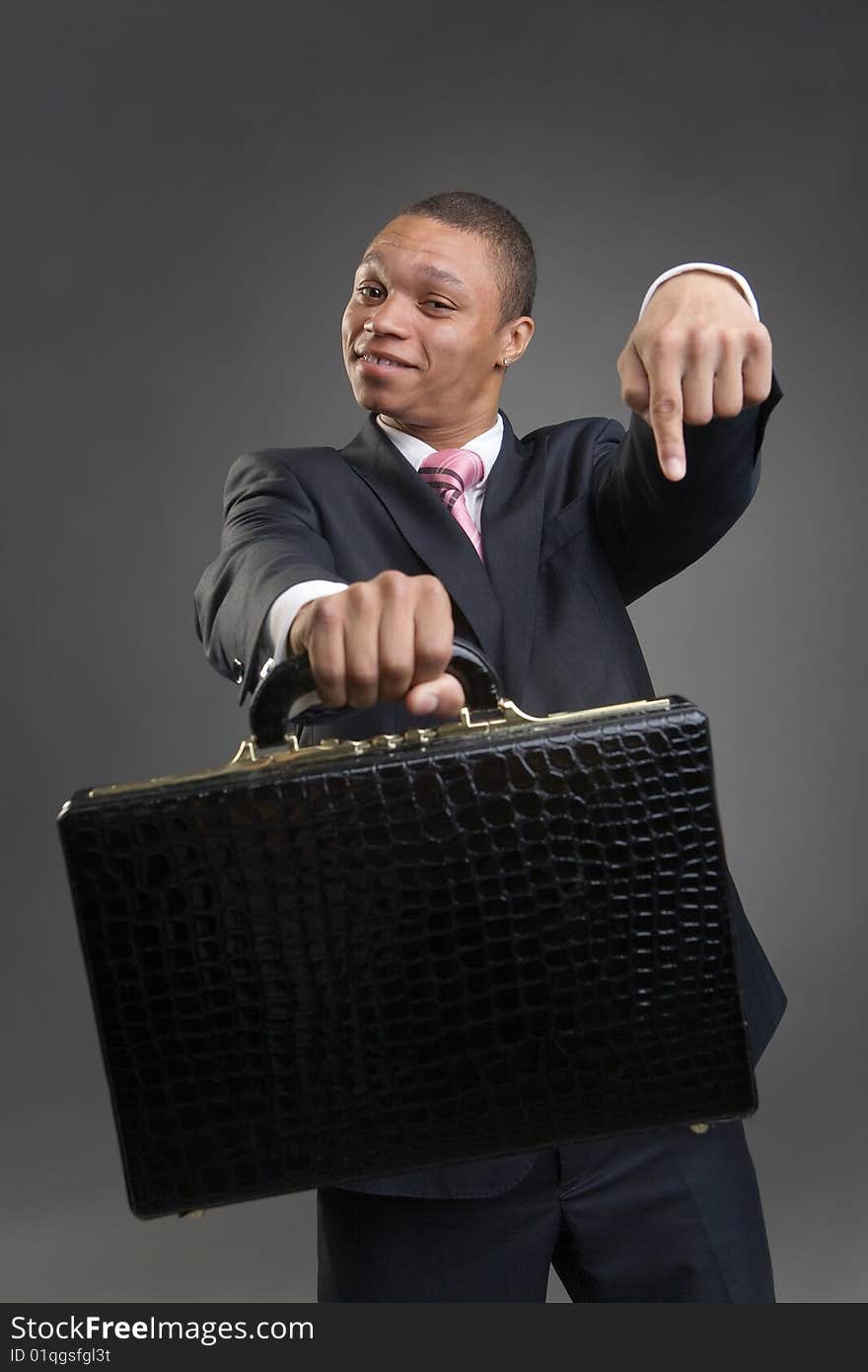 Businessman offers briefcase