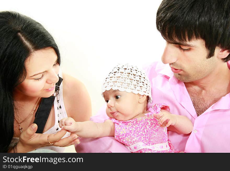 Happy family with baby daughter over white portrait