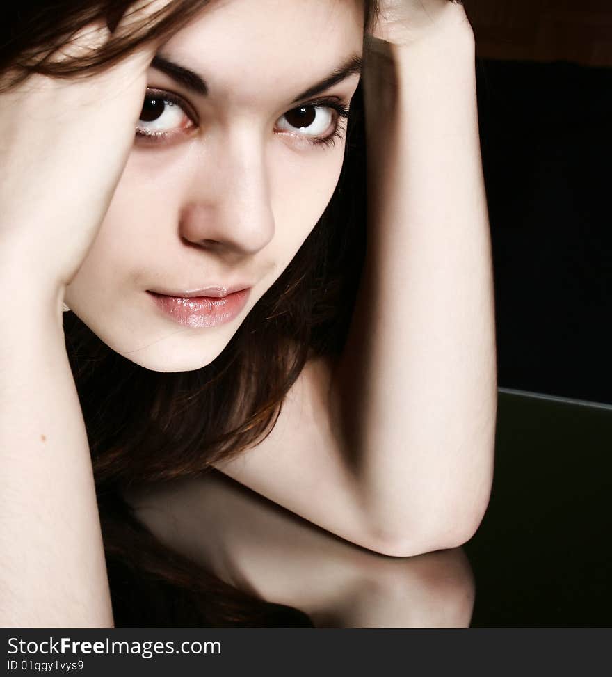 Portrait of the young brunette close up.