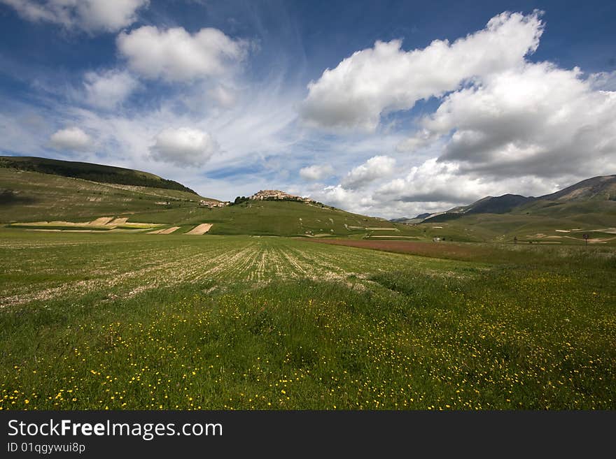 Mountain village during the spring with many flowers of lentils and the blue skye. Mountain village during the spring with many flowers of lentils and the blue skye