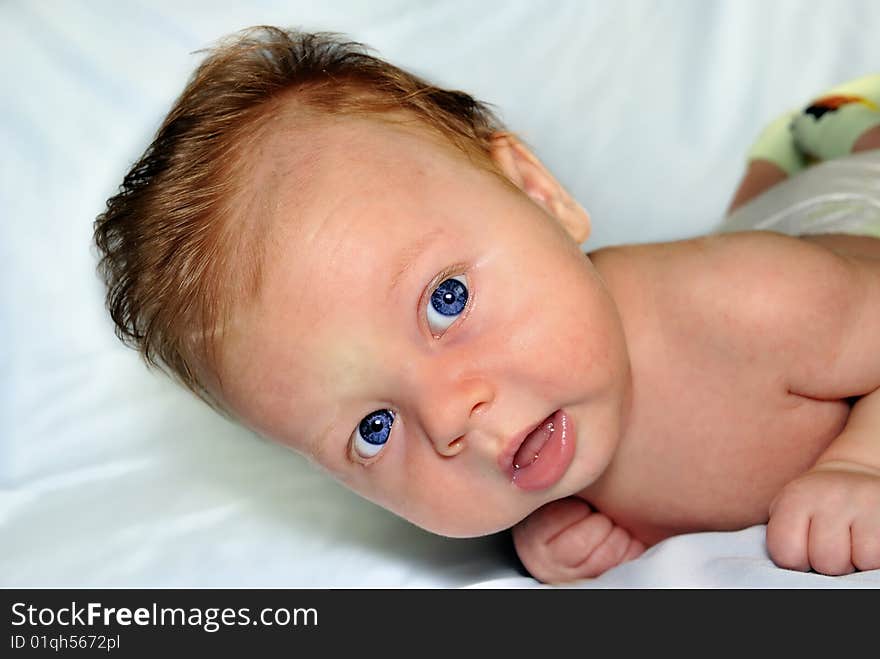 The nice kid learns to hold the head lying on a stomach. The nice kid learns to hold the head lying on a stomach.