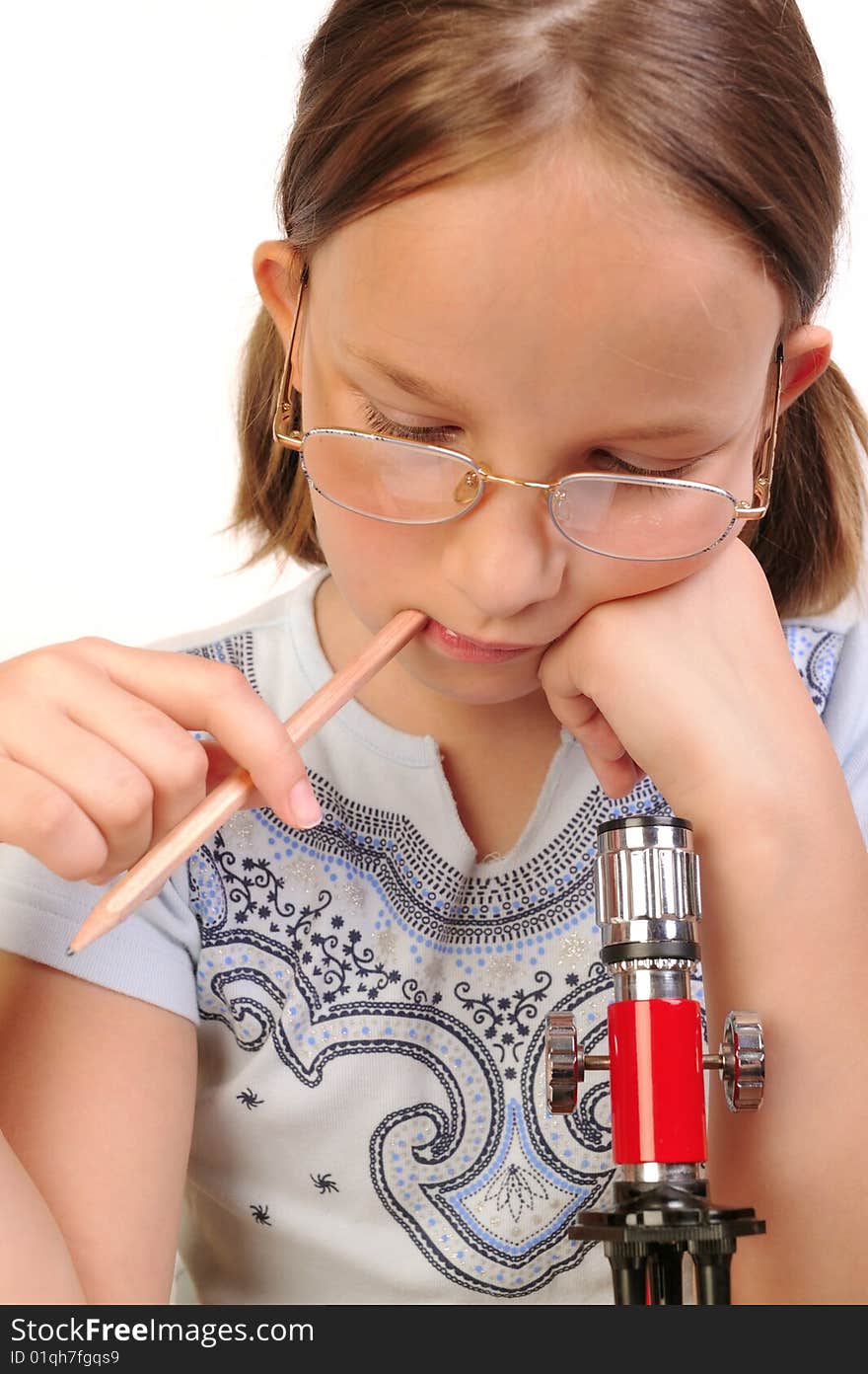 Girl studying something with microscope