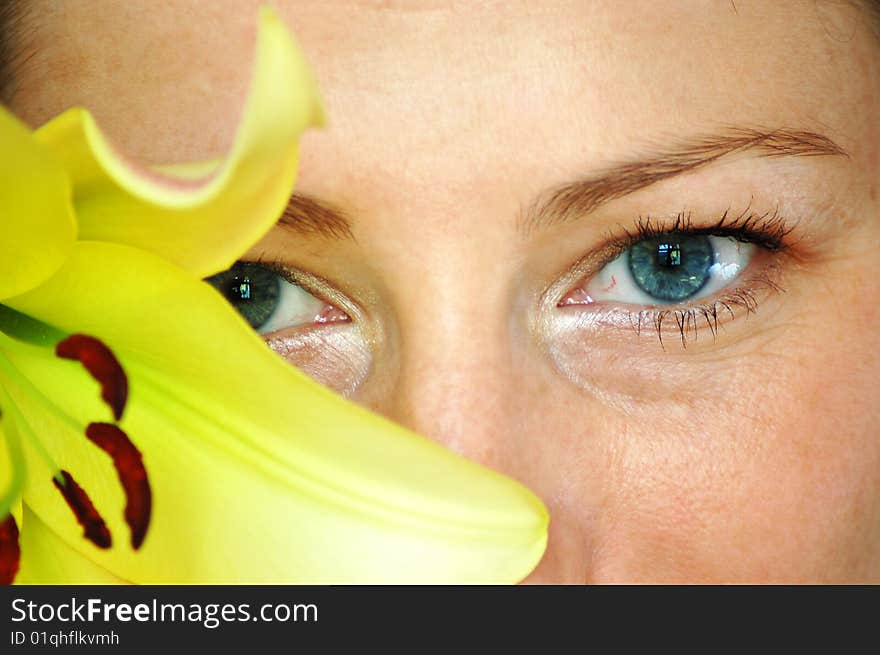 Beautiful woman with yellow liliy. Beautiful woman with yellow liliy