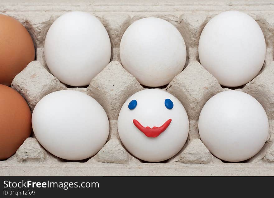 Egg in packing, smile