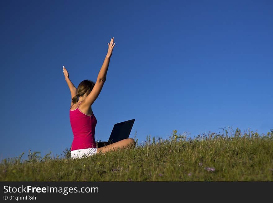 Beautiful young woman using a laptop, and happy. Beautiful young woman using a laptop, and happy.