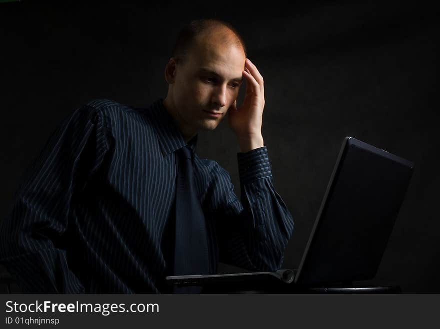 Businessman working on computer late at night