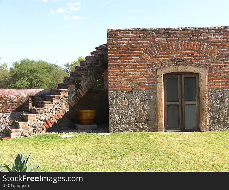 Pic of a stair and window made with bricks at an old Hacienda. Pic of a stair and window made with bricks at an old Hacienda