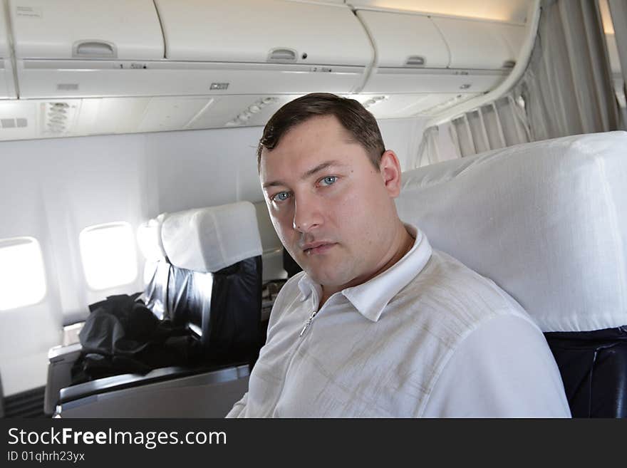 Tourist waits a flight in cabin of air liner. Tourist waits a flight in cabin of air liner