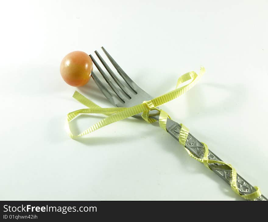 Celebration fork with a tomato