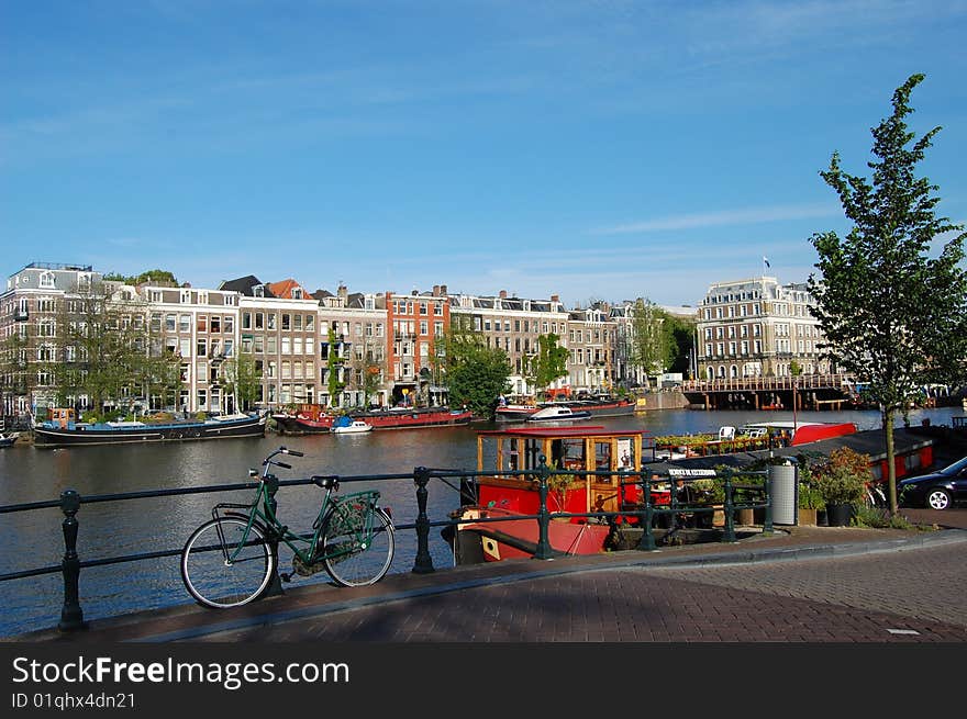 Old  Canal Houses in Amsterdam with a bike